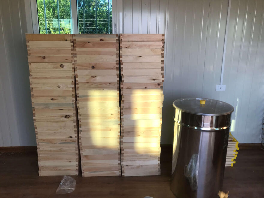 New materials - toppers for hives and an electric centrifuge for harvesting honey [normally has to be done by hand-crank].