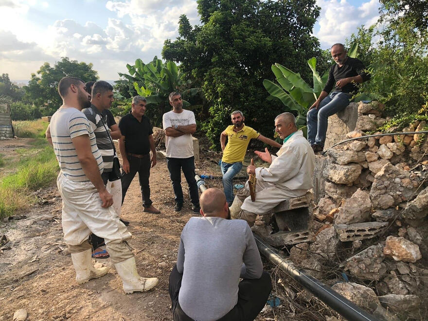 One of By Bee's early field trips. Beekeepers participated in hands-on training led by an experienced beekeeper.